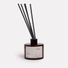 Honeysuckle bushflower diffuser in dark glass bottle.