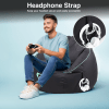 Man gaming, beanbag with headphone strap.