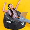 Happy girl relaxing with laptop, wearing headphones.