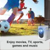 Kids playing soccer outdoors with a projector