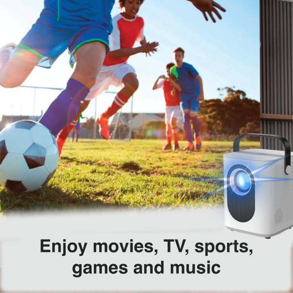 Kids playing soccer outdoors with a projector