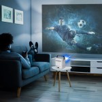 laser cube android projector with 120in screen Person watching football on projector at home.