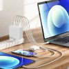 Laptop, tablet, phone charging on a desk