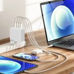 Laptop, tablet, phone charging on a desk