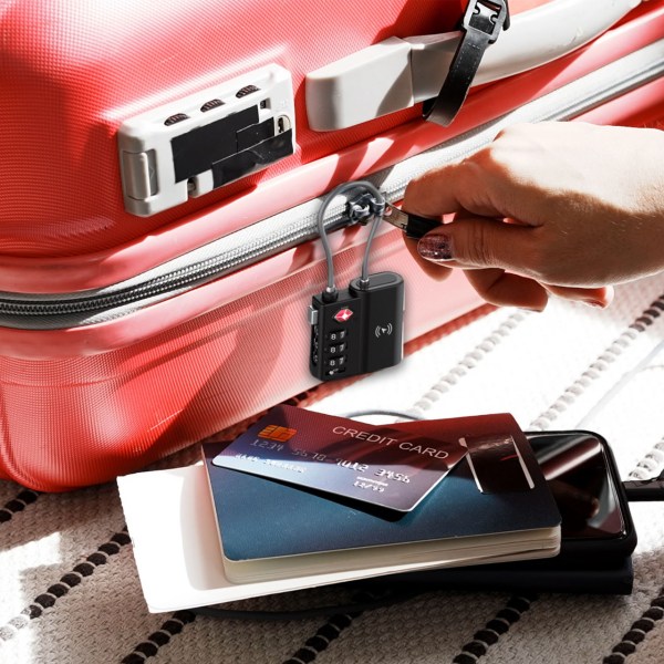 laser tsa lock smart tag with rechargeable battery black Suitcase with lock, credit card, passport nearby.