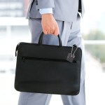laser tsa lock smart tag with rechargeable battery black Person in suit carrying black briefcase.