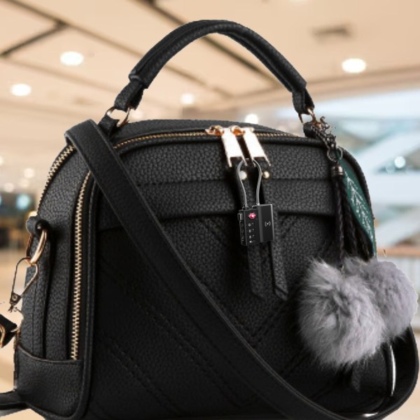 laser tsa lock smart tag with rechargeable battery black Black handbag with lock and pom-pom accessory
