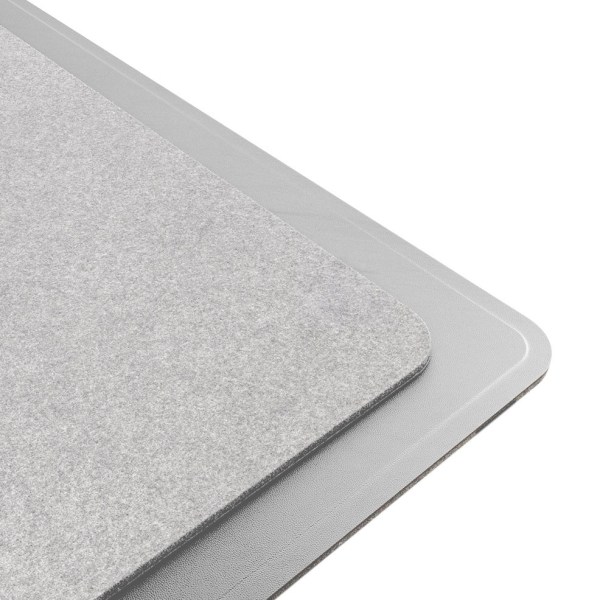laser wireless charging desk mat grey Two grey layered mats on white background.