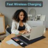 Woman using laptop with wireless charging pad