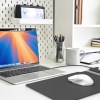 Modern desk setup with laptop and office supplies.