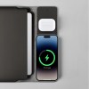 Charging station with phone and earbuds.