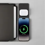 Charging station with phone and earbuds.