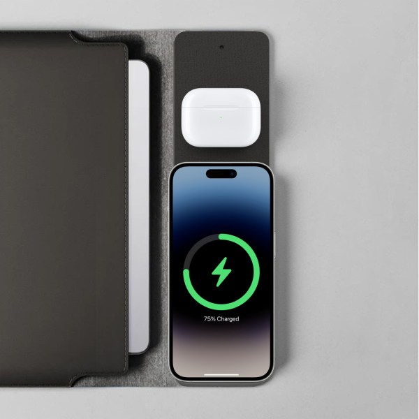 Charging station with phone and earbuds.