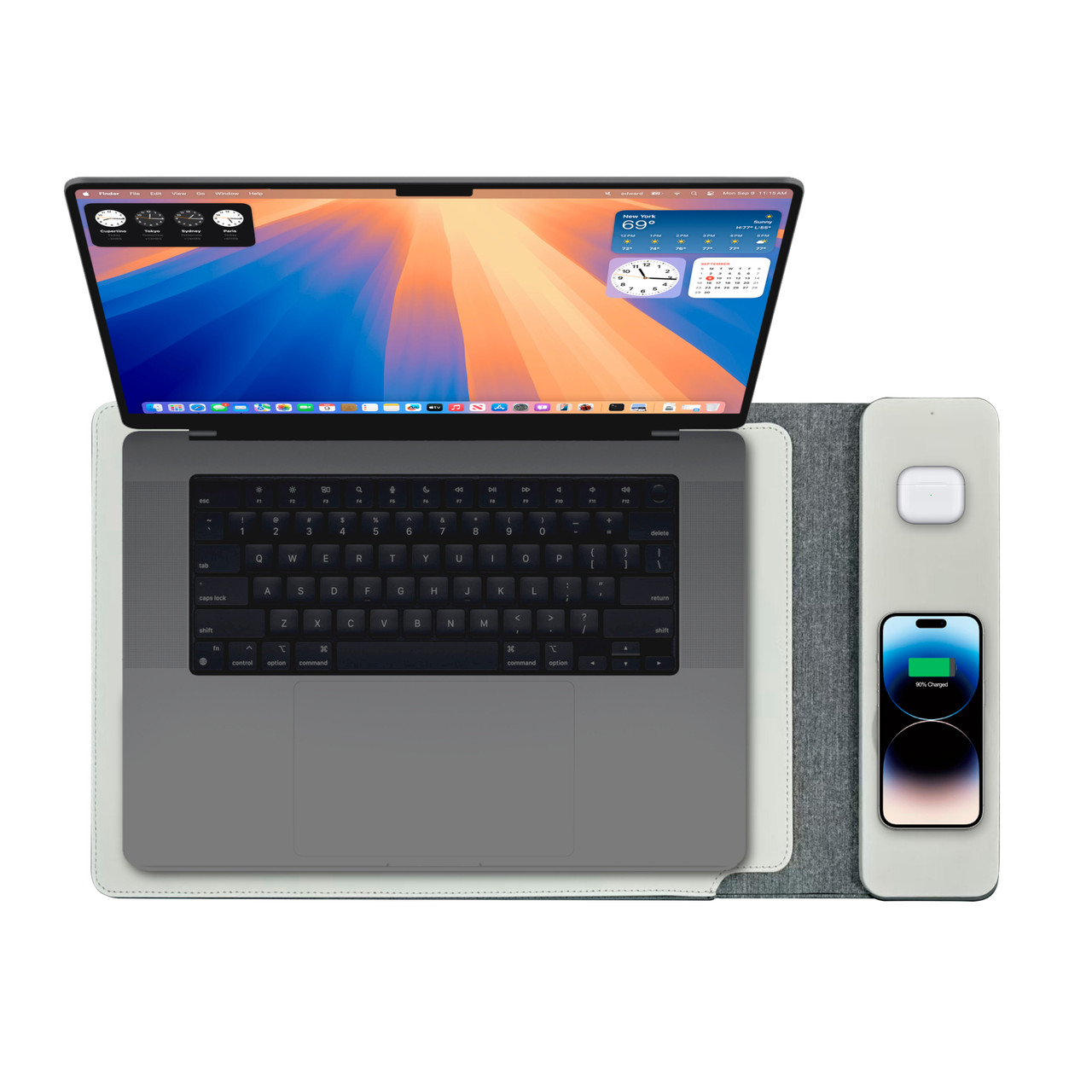 Laptop with phone and wireless charger on desk