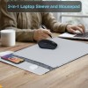 Grey laptop sleeve with mousepad on desk.
