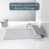 Magnetic folder with secure closure on desk.