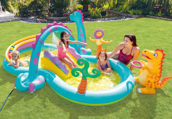 Children playing in dinosaur-themed inflatable pool