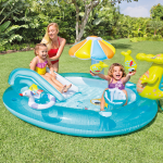 Kids playing in inflatable pool with toys.