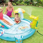 Children enjoying inflatable backyard paddle pool.