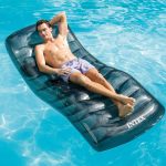 intex cool grey pool lounge 56875 Person relaxing on pool float in water