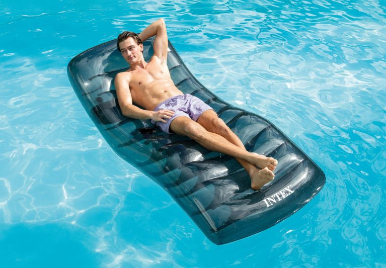 intex cool grey pool lounge 56875 Person relaxing on pool float in water