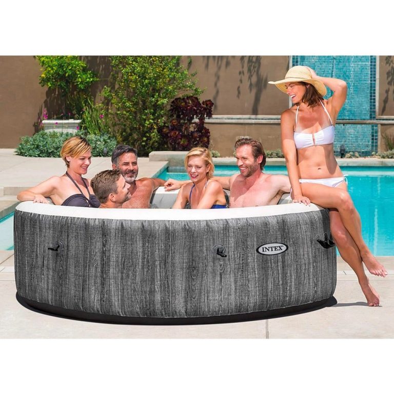 intex purespa 6 person greywood spa 28442 Group relaxing in outdoor hot tub by pool.