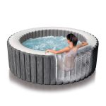 intex purespa 6 person greywood spa 28442 Person relaxing in an inflatable spa pool