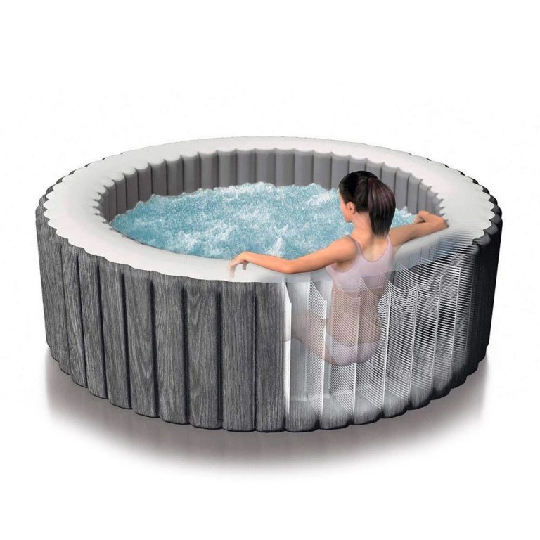 intex purespa 6 person greywood spa 28442 Person relaxing in an inflatable spa pool