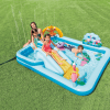 Children playing in inflatable backyard pool