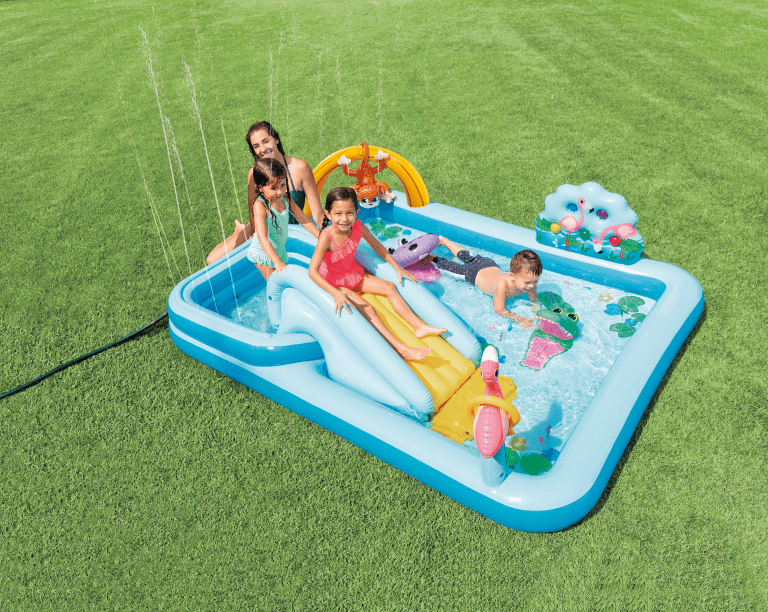 Children playing in inflatable backyard pool