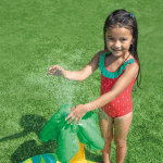 intex little dino inflatable play centre 57166 Girl playing with water sprinkler on grass