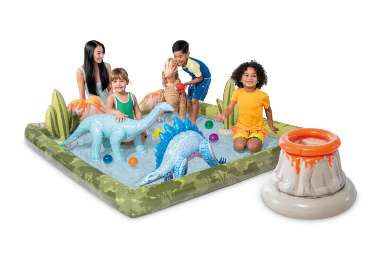v1032 ixjurassic 56132 202508201030 00.jpg Kids playing in inflatable dinosaur pool with toys.