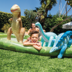 intex jurassic adventure inflatable play center 56132 Child and inflatable dinosaur toys in garden pool