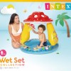 intex mushroom inflatable kiddie pool 57114 Child playing in inflatable mushroom pool.