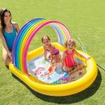 intex rainbow arch inflatable spray kiddie pool 57156 Children playing in rainbow inflatable kiddie pool