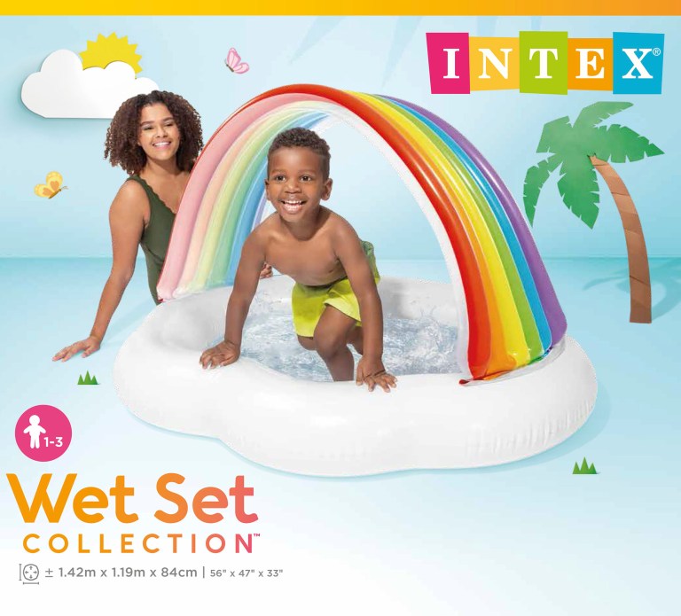 Child and adult in inflatable rainbow pool.