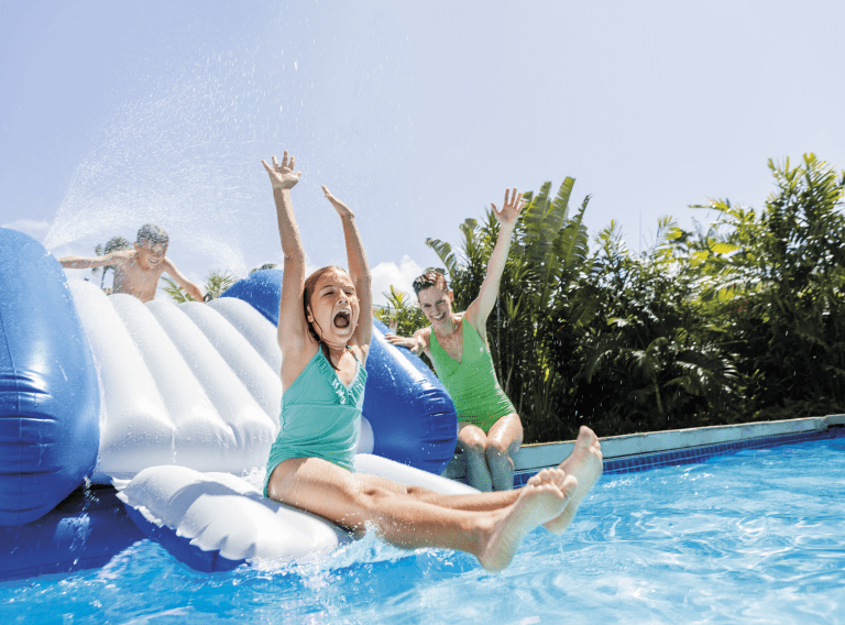 intex kool splash inflatable water slide with spray 58849 Kids enjoying water slide at pool