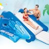 intex kool splash inflatable water slide with spray 58849 Kids playing on inflatable water slide outdoors.