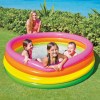 intex sunset glow pool 56441 Kids playing in colourful inflatable pool outdoors.