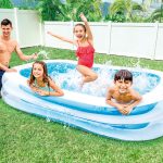 intex swim center family pool 56483 Kids enjoying inflatable pool in backyard.