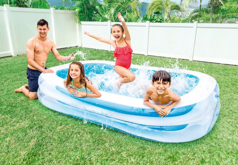 intex swim center family pool 56483 Kids enjoying inflatable pool in backyard.