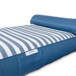 Blue and white striped outdoor cushion with headrest.