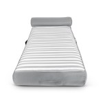 Grey-striped outdoor sunbed with headrest and handle.