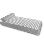 Striped inflatable mattress with pillow attached.