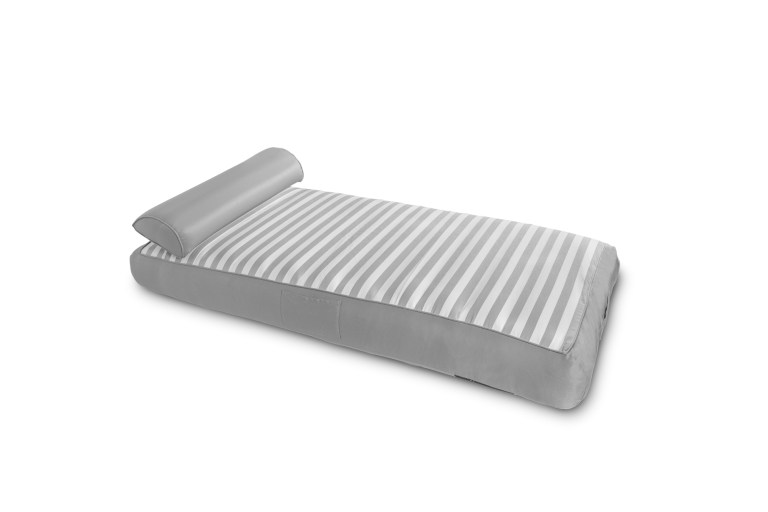 Striped inflatable mattress with pillow attached.