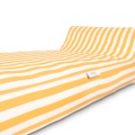 Yellow and white striped bed with headboard