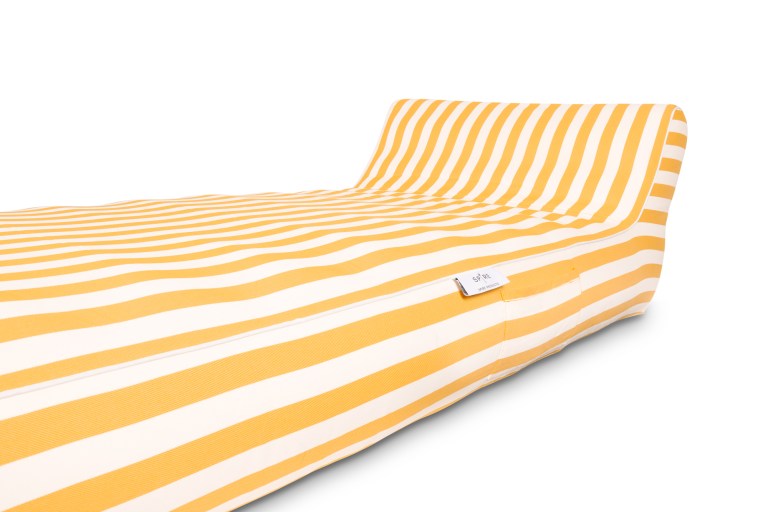 Yellow and white striped bed with headboard