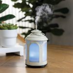 v1049 sdchl 202508141715 00.jpg Elegant aroma diffuser releasing mist on wooden table.