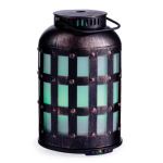 Vintage lantern with green glowing light.