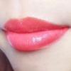 Glossy pink lips close-up.